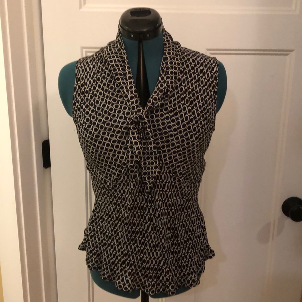 Harold’s silk sleeveless shirt.